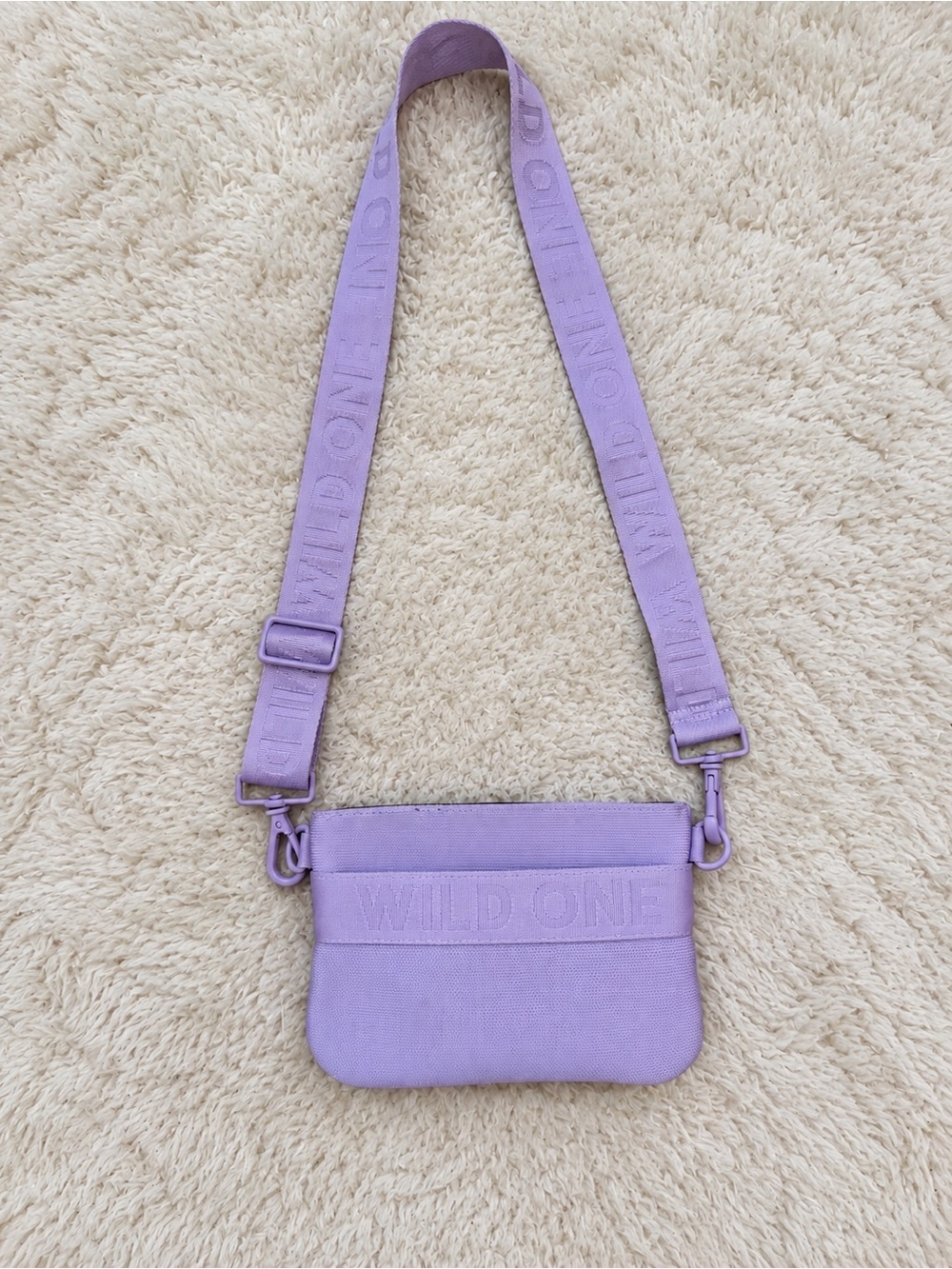 Lilac Embossed 'Wild One' Crossbody Bag with Adjustable Strap